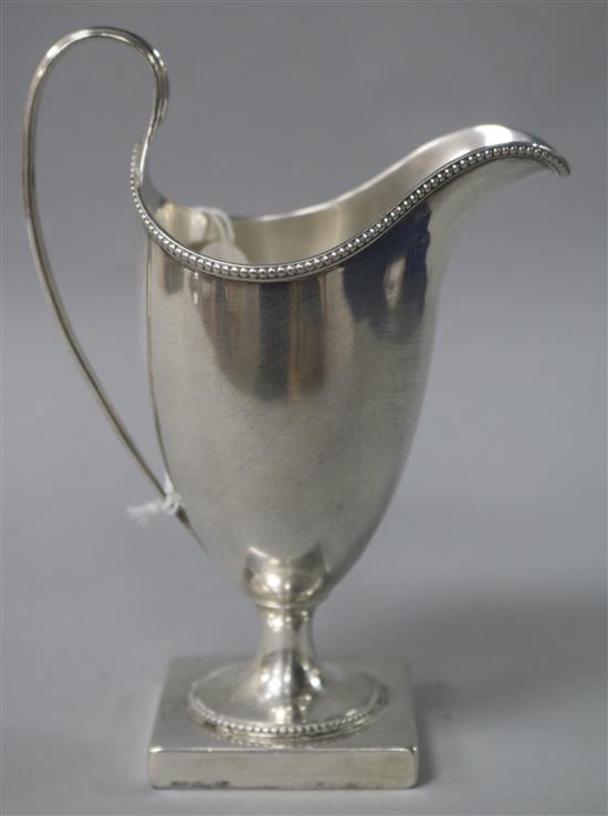 A George III silver helmet shaped cream jug by Peter & Ann Bateman, London, 1794, 14.6cm.